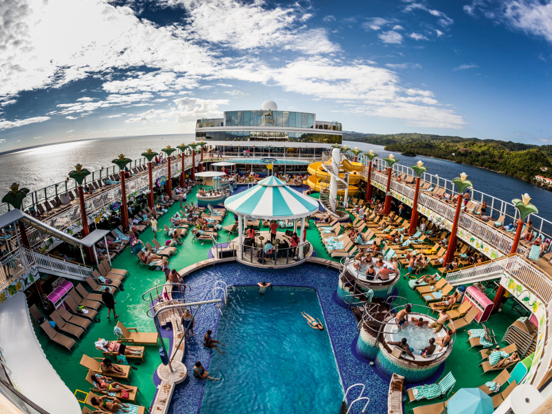 View of a cruise ship pool and deck from above.