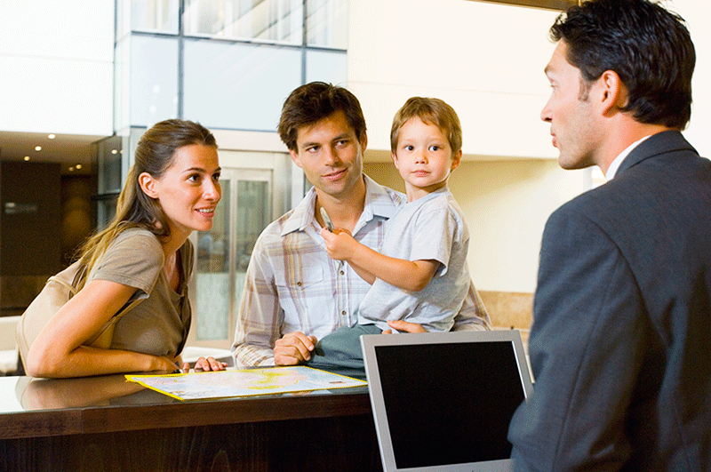 Image of a family (or passengers), talking to the staff of an airline, who are unaware of their rights. 