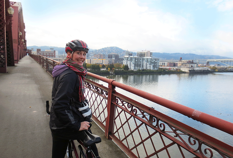 The author on a bike at Willamette Bridge in Portland, Oregon.