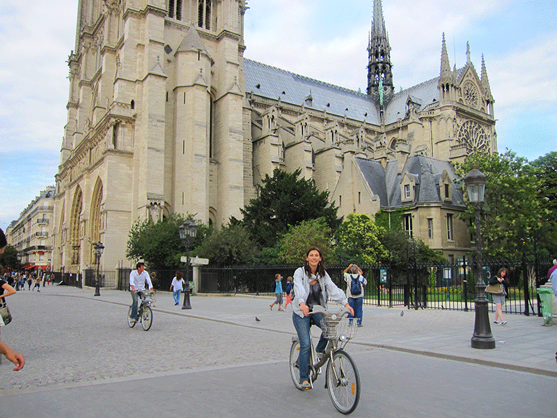 The author riding a bicycle in Paris, France.