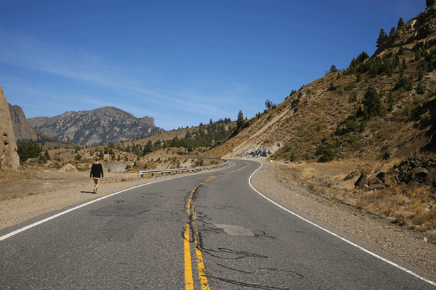 Young voluntourist walking along the Route of Seven Lakes Argentina