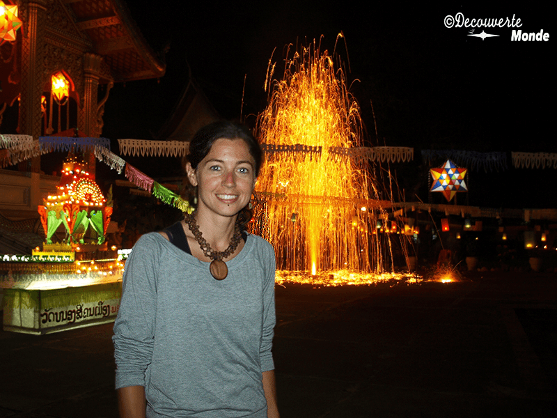 Girl in the foreground at night at the Festival of Lights in Luang Prabang, Laos 