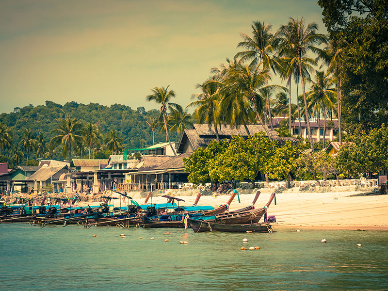 Long-tail boats at beach in Krabi, Thailand.