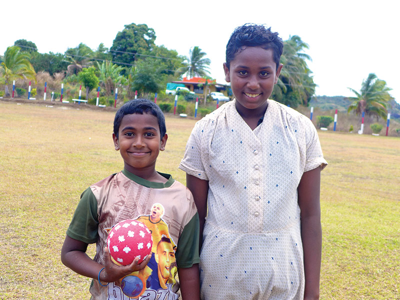 This is a photo of a boy and girl student taken while volunteering in WavuWavu, Fiji. 