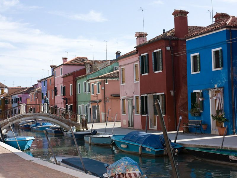 Burano presenting its bright coloured houses and its breathtaking sinuous canals