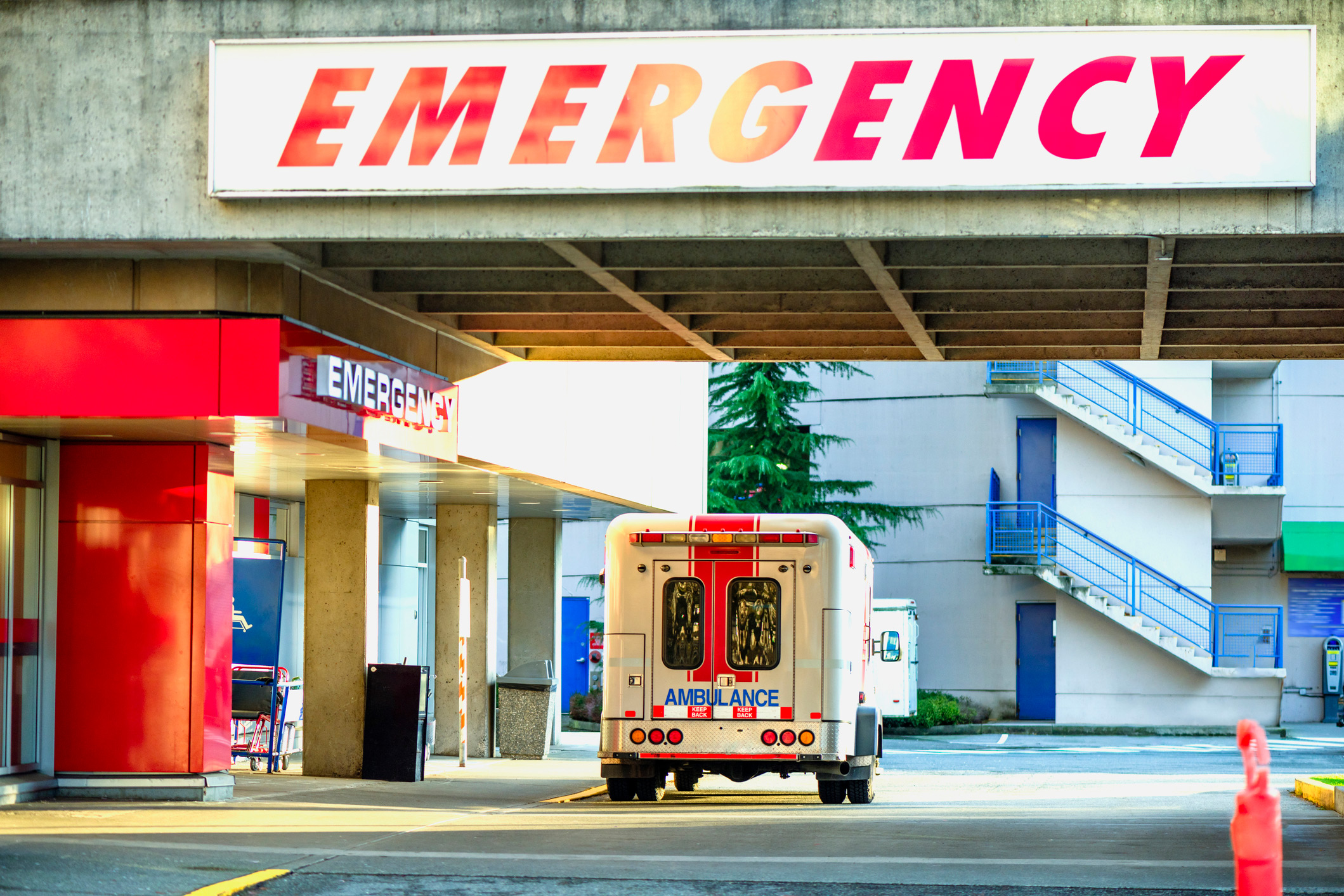 Shows exterior of emergency entrance at hospital.