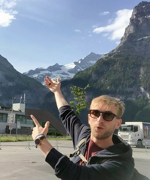 Traveller at the foot of the mountain, Switzerland