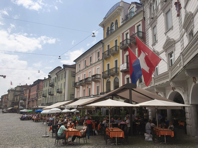 Tourists enjoying a meal on a terrace