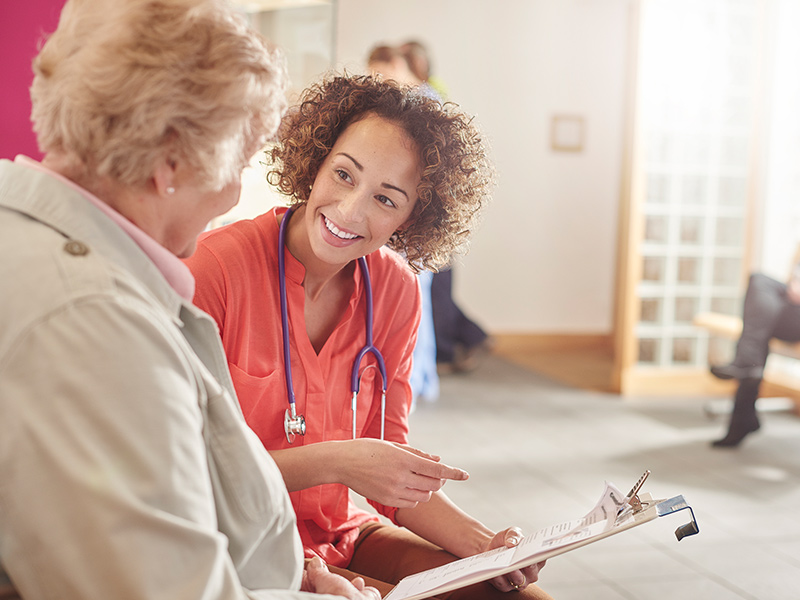 Doctor advising senior.