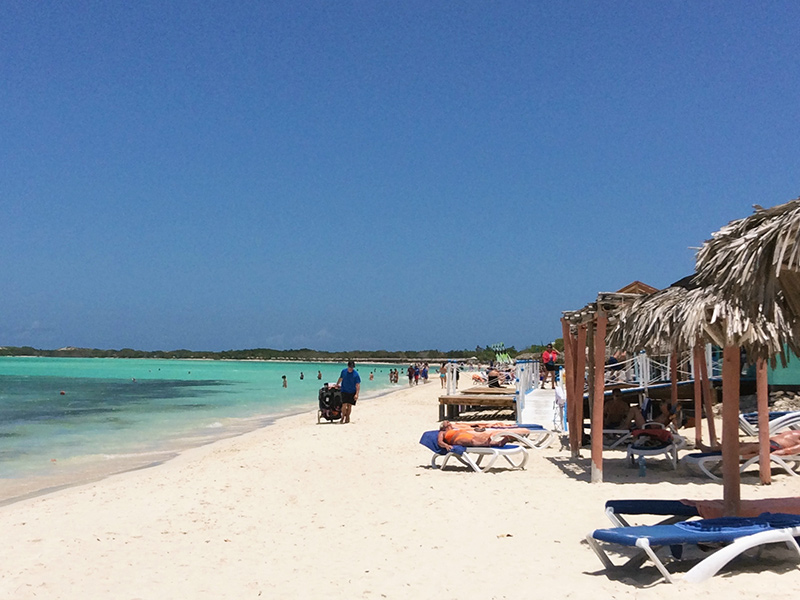tourists sunbathing on the beach