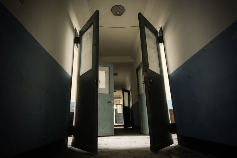 Hallways of a defunct sanitorium