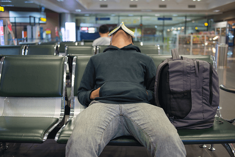 Person sleeps at airport after cancelled flight leaves them stranded