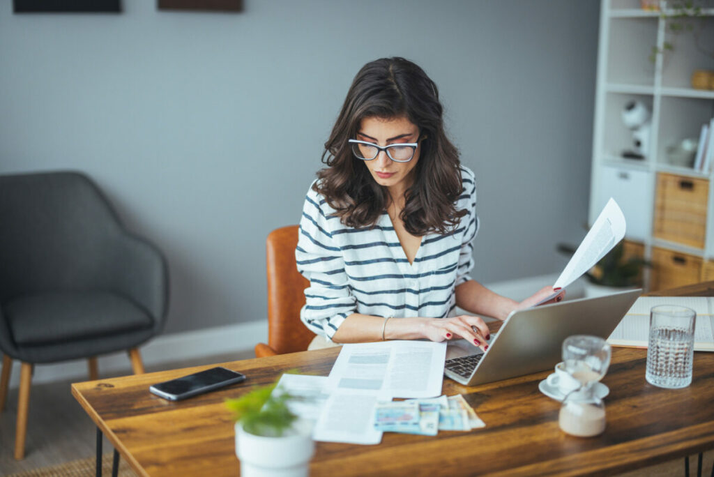 woman checking receipts 