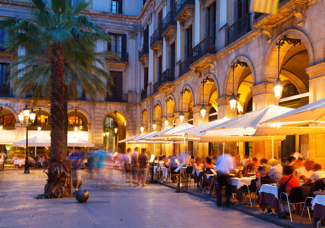 people dine alfresco in Barcelona plaza