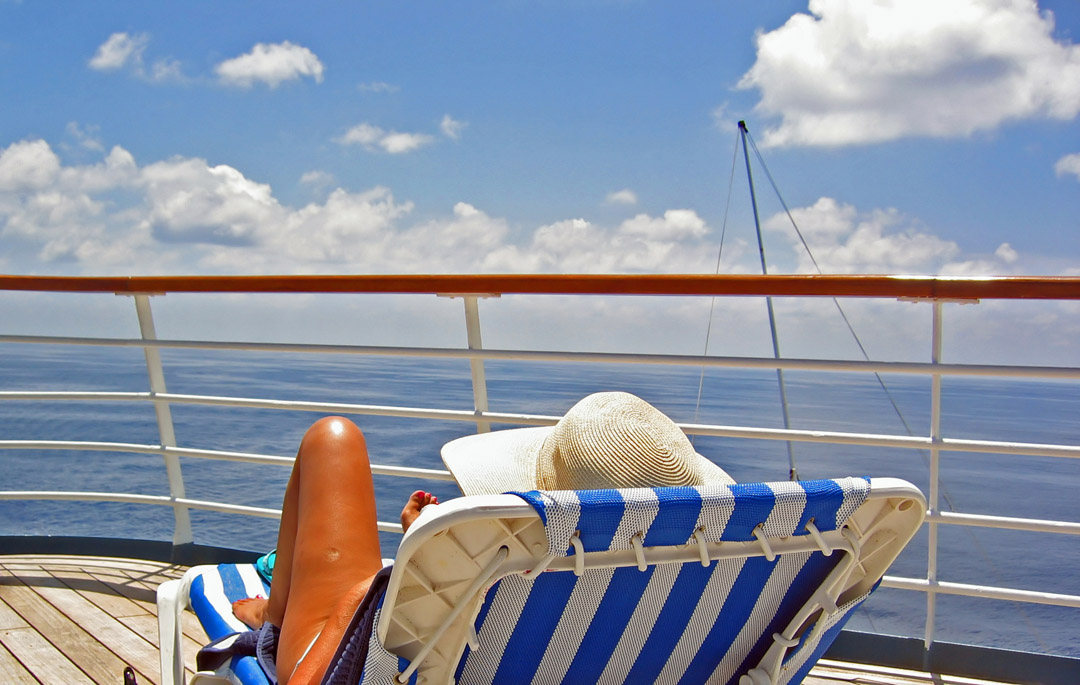 woman relaxes on cruise deck