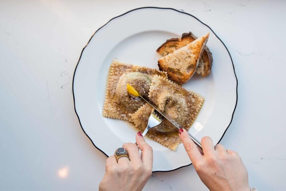 Ravioli on white plate, PIANO PIANO, Toronto, ON