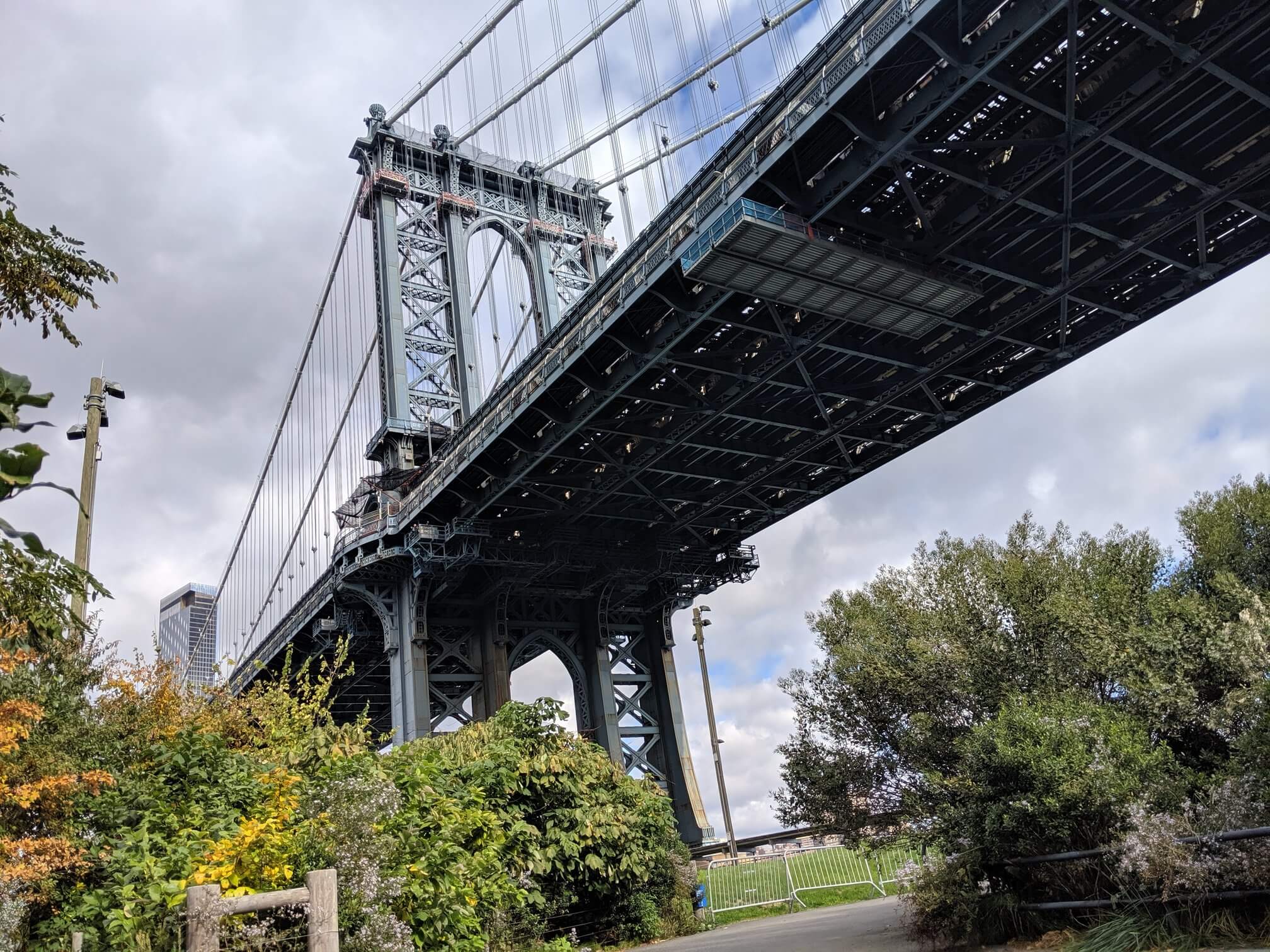 View of Manhattan Bridge from below. Seen from Booklyn Bridge Park in DUMBO, Brooklyn, NYC