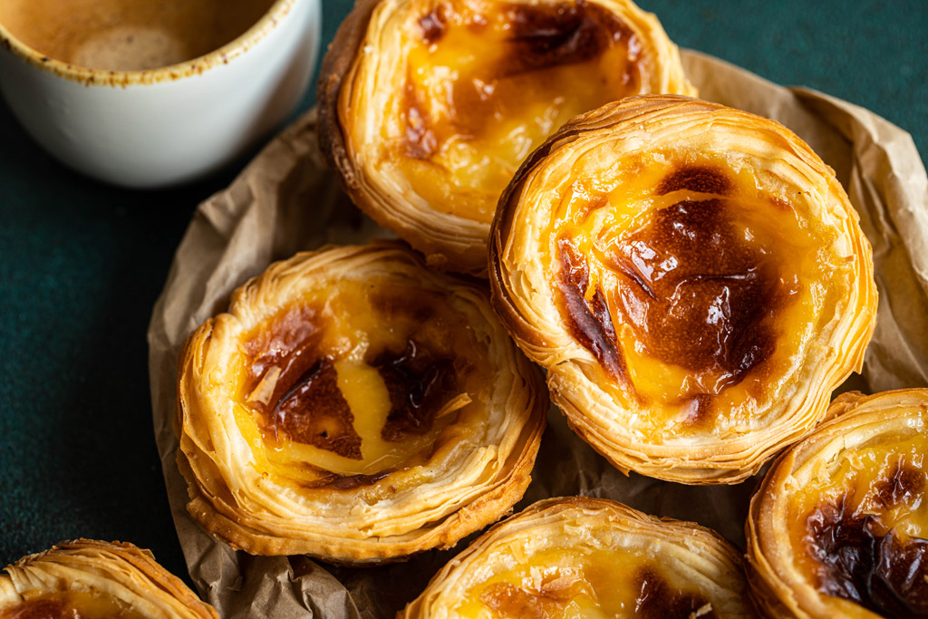 Pile of fresh traditional Portuguese pastel de nata