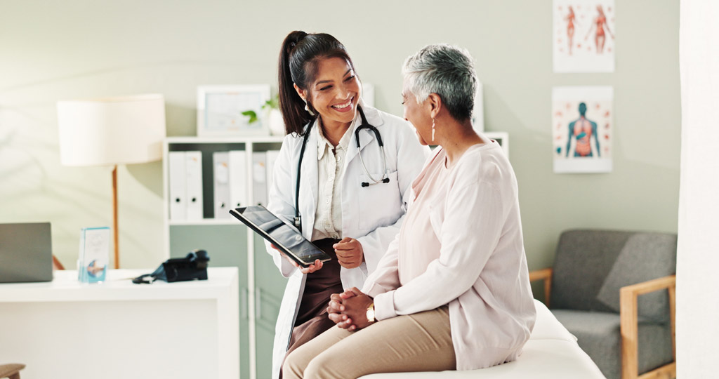Mature patient, doctor at an appointment in office
