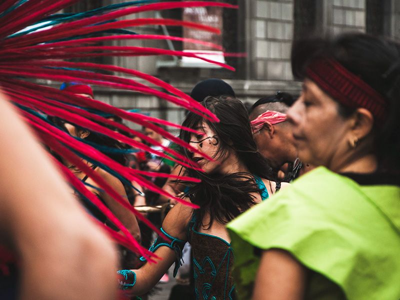 An Aztec girl participates in the dancing.